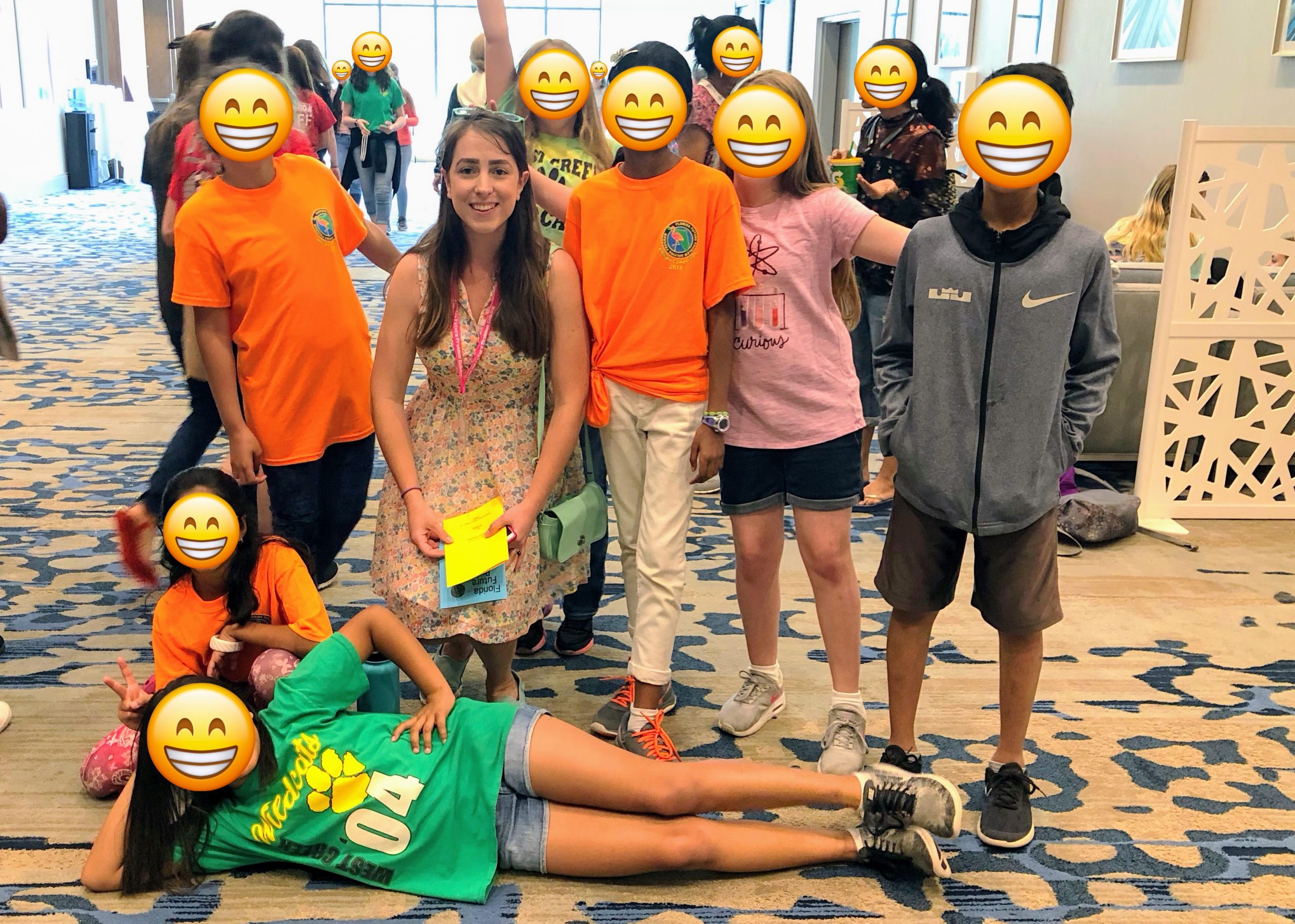 Teacher posing with team of students
